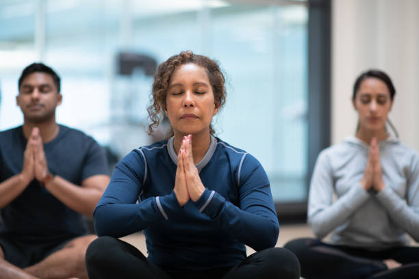 istock A diverse group of people doing a yoga class 1148855606