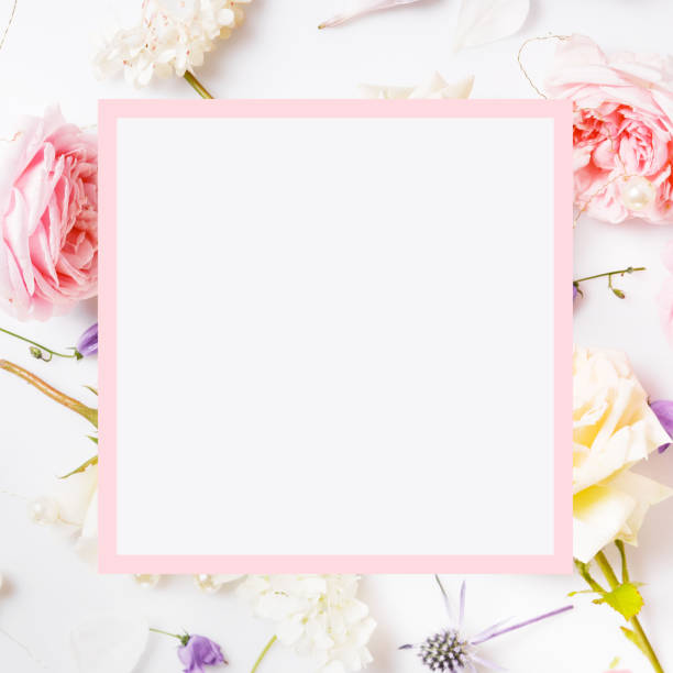 istock Festive flower composition on the white wooden background. Overhead view 1148856034