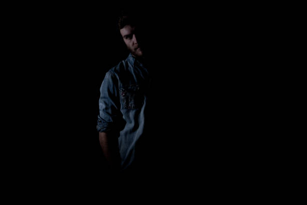 istock Cool hip man standing in front of black background 1148857718
