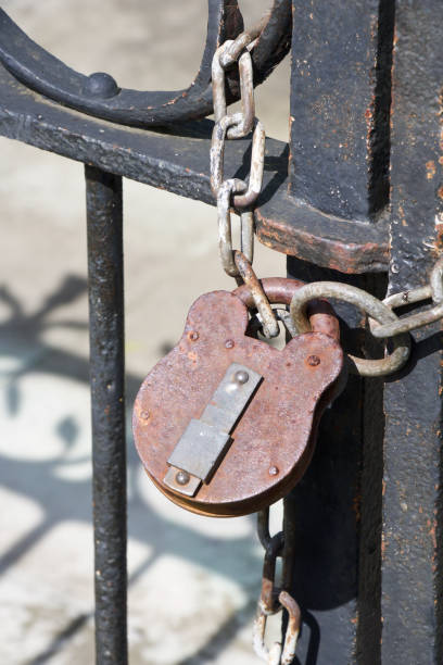 istock Metal padlock connected to a metal chain. 1148857838