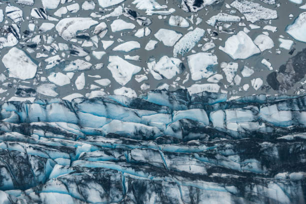 istock Glacier face and ice from above in abstract form, Alaska. 1148859218