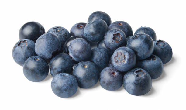 istock A small pile of fresh juicy blueberries isolated on white. Side view. 1148859310