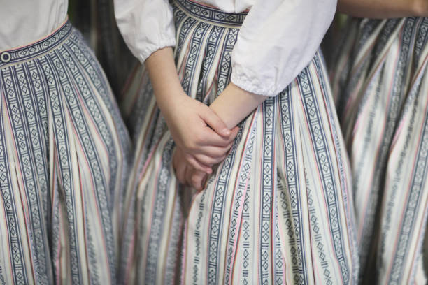 The hands of a girl in an ethnographic costume from a folklore dance group