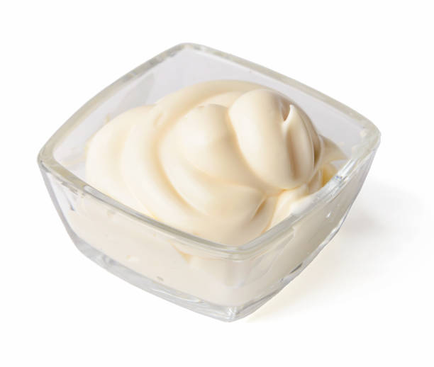 istock Mayonnaise in glassware isolated on white background. Top side view. 1148860639