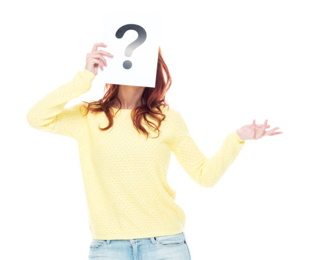 istock Cute young female wearing a yellow sweater and light blue jeans 1148861102