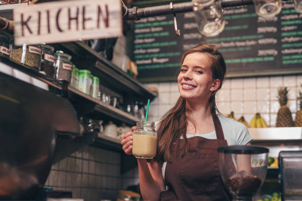 istock Young attractive girl with smoothie 1148861253