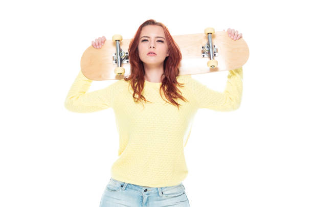 istock Cute female holding a skateboard 1148861768