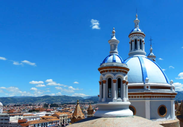 Cuenca, Ecuador, cityscape and cthedral's domes Cuenca, Ecuador. The blue domes of the New Cathedral or Catedral de la Inmaculada Concepcion de Cuenca and cityscape. View from observation deck. Historical center of Cuenca is UNESCO worl heritage site cuenca ecuador stock pictures, royalty-free photos & images
