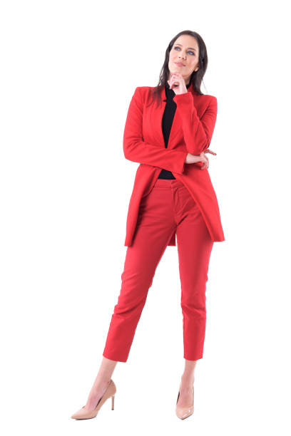 istock Thoughtful elegant business woman in red suit looking up thinking having idea. 1148865686
