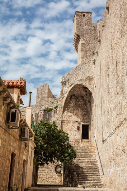 Back of the Minceta Tower on the beautiful walls of Dubrovnik old town Dubrovnik, Croatia - April, 2018: Back of the Minceta Tower on the beautiful walls of Dubrovnik old town fort minceta dubrovnik stock pictures, royalty-free photos & images