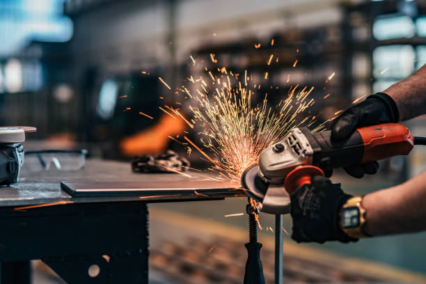 grinding metal with small grinder, close-up. - grinding imagens e fotografias de stock