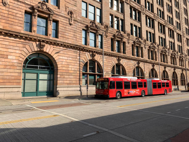 Pittsburgh, USA    May 9, 2019\nRed Port Authority bus stopped on East Busway at Penn Station.  iPhone