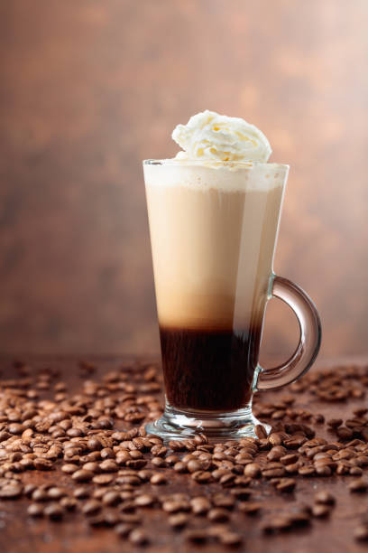 istock Glass cup with coffee and coffee beans on a brown background. 1148868878