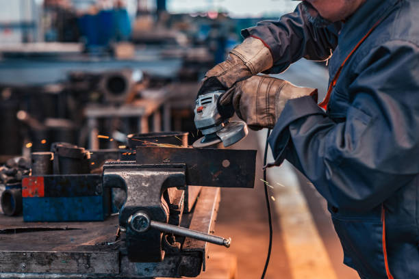 istock Close-up image of heavy industry worker working with grinder. 1148868975
