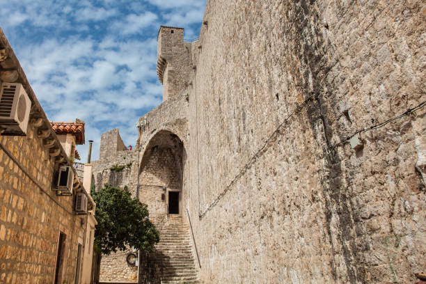 Back of the Minceta Tower on the beautiful walls of Dubrovnik old town Dubrovnik, Croatia - April, 2018: Back of the Minceta Tower on the beautiful walls of Dubrovnik old town fort minceta dubrovnik stock pictures, royalty-free photos & images