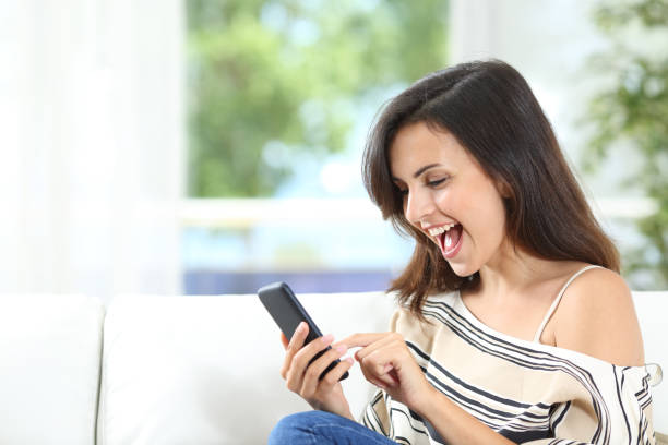 istock Excited tenant finding offers on phone at home 1148871354