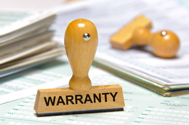 istock Warranty printed on rubber stamp 1148872180