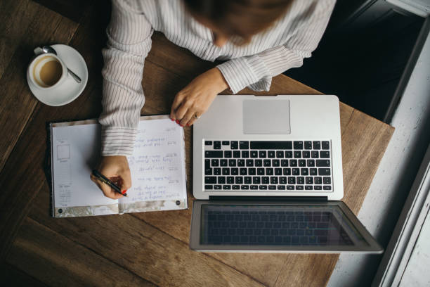istock Attractive woman working on a laptop computer 1148874018