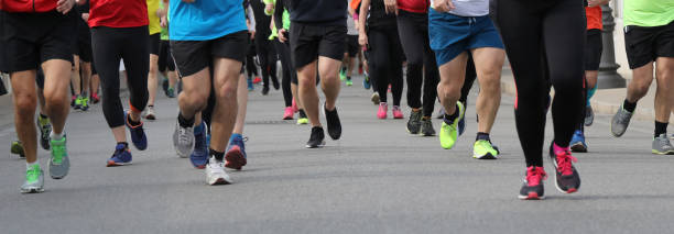 istock legs of many people during a race 1148874108