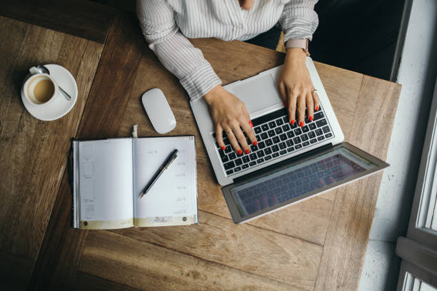 istock Attractive woman working on a laptop computer 1148874246