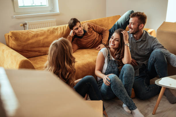 The joy of friendship Shot of group of friends on a moving day roommate stock pictures, royalty-free photos & images