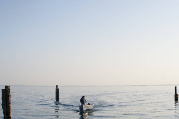 istock Fisherman on a boat on Lake Garda 1148875595