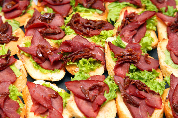 istock fresh sandwiches with ham and herbs on the table 1148878473