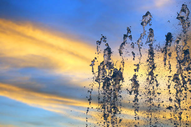 istock drops of the fountain in the setting sun 1148879312