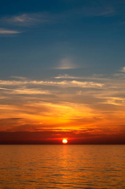 istock Red, gold and blue sunset at sea 1148879928