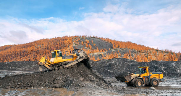 istock The bulldozer and loader work together in a mountainous area 1148880213