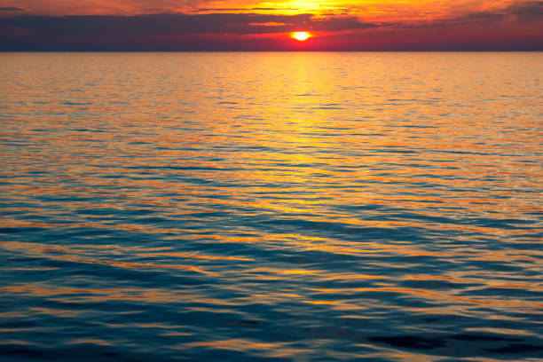 istock Setting sun near the horizon at sea 1148880239