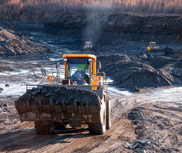 istock Autumn, Bucket loader in operation, in Mountain area (gold mining industry) 1148880260