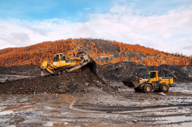istock The bulldozer and loader work together in a mountainous area 1148880406