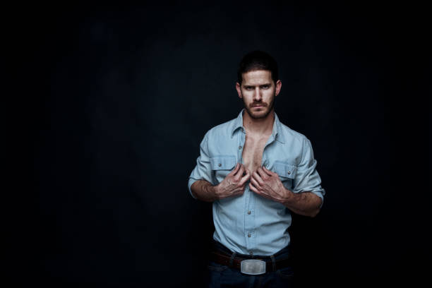 istock Sexy cowboy undressing 1148882367