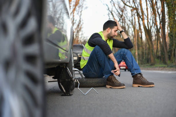 istock A broken tire on the car 1148882969