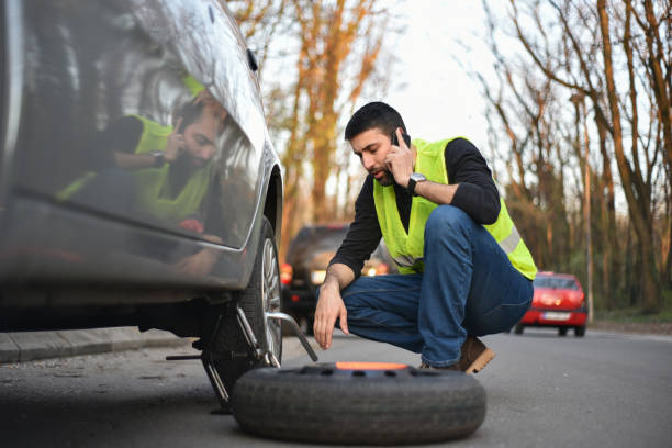 istock A broken tire on the car 1148883812