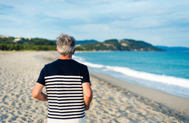 istock Senior man running on the beach 1148883949