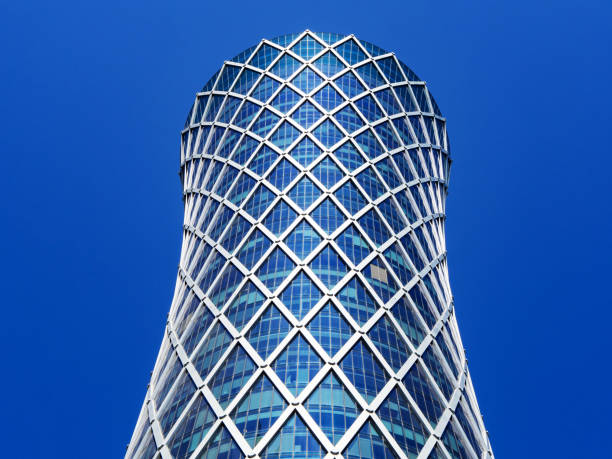istock Financial success concept. Modern skyscraper on blue background with copyspace (Qipco Tower, Tornado Tower) 1148884981