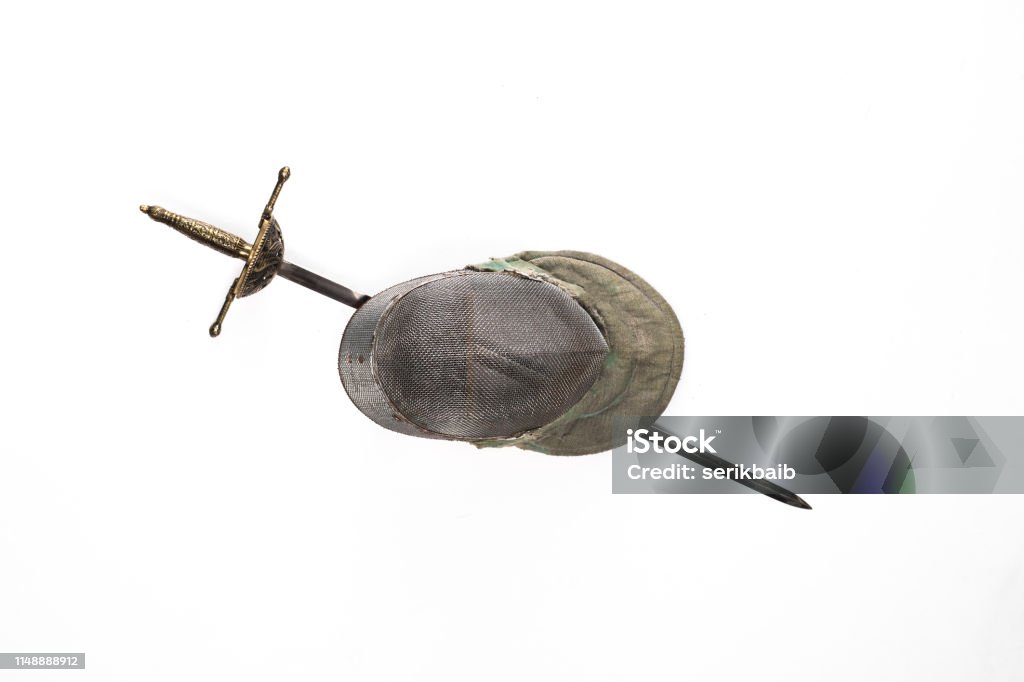 fencing helmet and sword, saber, rapier isolated on a white background Ancient Stock Photo