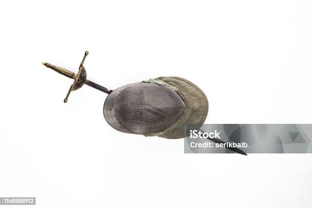 Fencing Helmet And Sword Saber Rapier Isolated On A White Background Stock Photo - Download Image Now