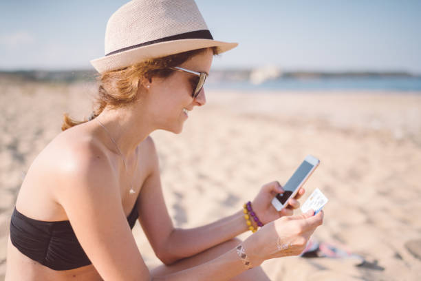 istock Online shopping at the beach 1148889085