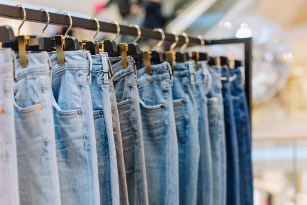 stylish jeans clothing store stands showcase boutique stylish jeans pants in a clothing store on the stands showcase with labels for the inscription jeans stock pictures, royalty-free photos & images