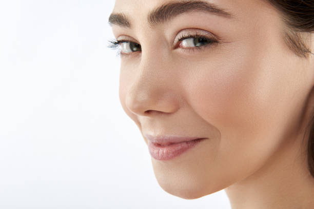 istock Coquettish smiling cute brunette female on white 1148893802