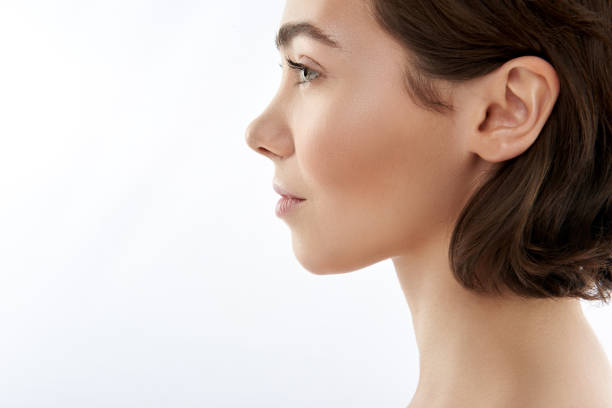 istock Side view of pretty sensual brunette female 1148893859