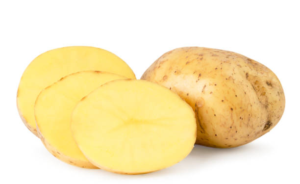 istock Potatoes and sliced pieces close up on a white. Isolated. 1148895231