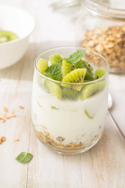 istock Yogurt, granola and kiwi in glass 1148895364