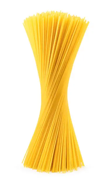 Raw spaghetti stands on a white background, isolated. Pasta