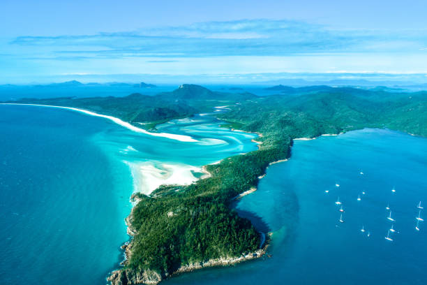 Hill inlet, Whitsunday IslNd1, Australia The hill inlet at Whitsunday island, off Airlie beach in tropical Queensland, is one of Australia's most photographed landmarks. The pristine blue waters of the Great Barrier reef is interrupted by world's purest grade silica and creates mesmerizing shades! airlie beach stock pictures, royalty-free photos & images