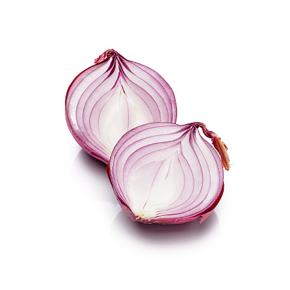 Fresh organic red onion (Also called Spanish Onion) cut in halves isolated on white background. Predominant colors are purple and white. High key DSRL studio photo taken with Canon EOS 5D Mk II and Canon EF 100mm f/2.8L Macro IS USM.