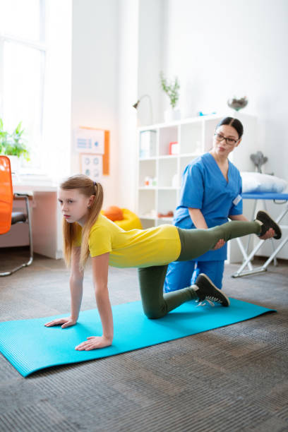 istock Focused blonde patient working out her body and muscles 1148899929
